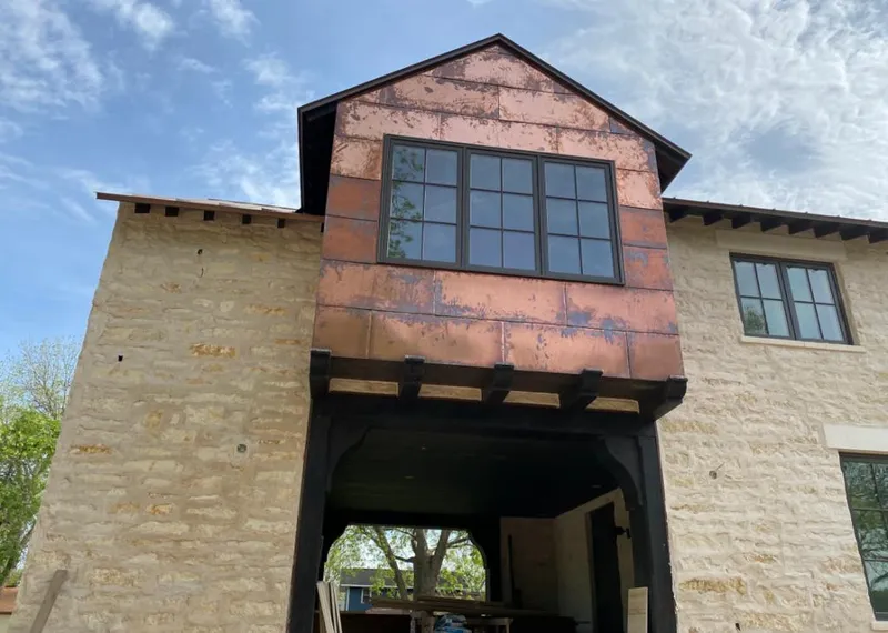 Copper metal panel facade on a stone building for Skylight Installation in Cliffside Park